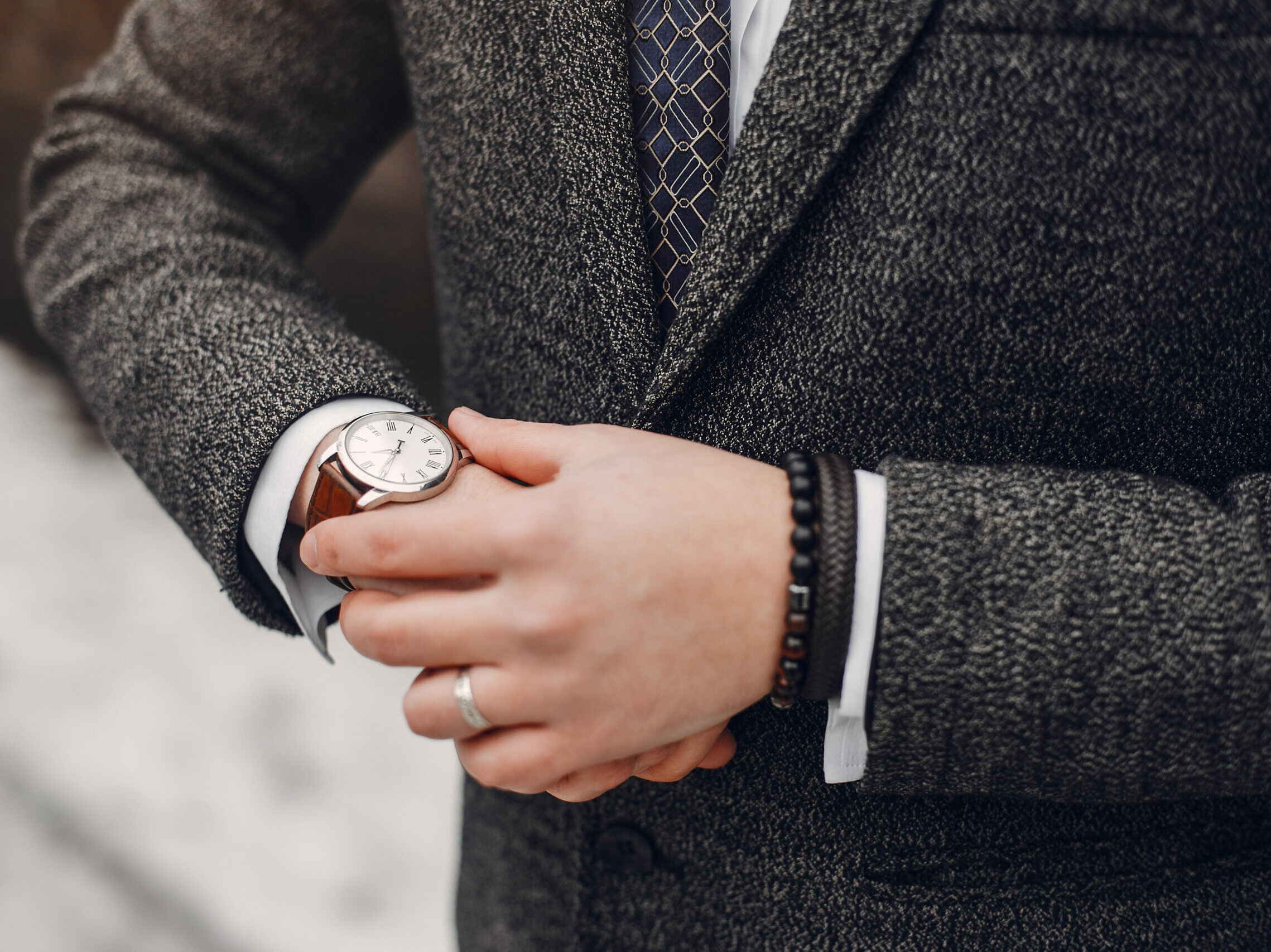 Handsome man in a black suit. Businessman working in a city